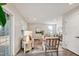 Cozy living room with plush furniture, featuring two large windows that provide plenty of natural light at 240 Amber Acorn Ave, Raleigh, NC 27603