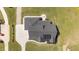 Overhead view of the home's roof, driveway, and landscaping details at 2408 Eddie Howard Rd, Willow Springs, NC 27592