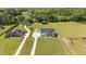 Wide aerial view showcasing the home, other structures, and expansive yard at 2408 Eddie Howard Rd, Willow Springs, NC 27592