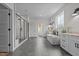 Bright and spacious bathroom featuring modern fixtures, walk-in shower, and soaking tub at 2408 Eddie Howard Rd, Willow Springs, NC 27592