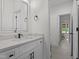 Modern bathroom with white vanity, countertop, and hardware at 2408 Eddie Howard Rd, Willow Springs, NC 27592