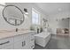 Elegant bathroom features double vanity, soaking tub, and sleek fixtures at 2408 Eddie Howard Rd, Willow Springs, NC 27592