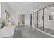 Bright bathroom boasts a large glass shower, soaking tub, and modern finishes at 2408 Eddie Howard Rd, Willow Springs, NC 27592