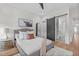 Comfortable bedroom with a queen-sized bed, ensuite bathroom access, and wood flooring at 2408 Eddie Howard Rd, Willow Springs, NC 27592