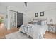 Relaxing bedroom with decorative wall paneling, and ensuite bathroom at 2408 Eddie Howard Rd, Willow Springs, NC 27592