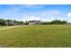 New farmhouse with long driveway and ample yard space surrounded by mature trees at 2408 Eddie Howard Rd, Willow Springs, NC 27592