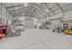 Spacious garage featuring a concrete floor, tall ceilings and plenty of room for projects and storage at 2408 Eddie Howard Rd, Willow Springs, NC 27592