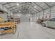 Spacious garage with concrete floor, overhead lights, and ample space for storage or a workshop at 2408 Eddie Howard Rd, Willow Springs, NC 27592