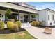 Beautiful patio featuring elegant landscaping, comfortable seating and a covered dining area perfect for entertaining guests at 2408 Eddie Howard Rd, Willow Springs, NC 27592