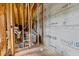 Exposed utility room construction showing roughskin and plumbing at 2408 Eddie Howard Rd, Willow Springs, NC 27592