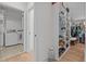 Walk-in closet offers custom shelving, a laundry area, and ample storage space at 2408 Eddie Howard Rd, Willow Springs, NC 27592