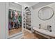 Spacious walk-in closet featuring custom shelving and a stylish seating area at 2408 Eddie Howard Rd, Willow Springs, NC 27592