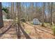 The backyard has woods and a small storage shed at 2412 Mollynick Lane Ln, Wake Forest, NC 27587