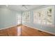Bedroom with hardwood floors, shutters, and outdoor access at 2412 Mollynick Lane Ln, Wake Forest, NC 27587