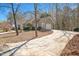 Exterior view of a house with a long driveway and front-facing garage at 2412 Mollynick Lane Ln, Wake Forest, NC 27587