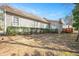 Back exterior of home, with wooden siding, white framed windows with shutters, and a red deck at 2412 Mollynick Lane Ln, Wake Forest, NC 27587