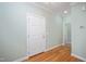 Inviting entry hallway with hardwood floors and neutral paint at 2412 Mollynick Lane Ln, Wake Forest, NC 27587