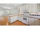 Bright kitchen featuring white cabinets, butcher block countertops, and modern appliances at 2412 Mollynick Lane Ln, Wake Forest, NC 27587