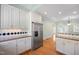 Spacious kitchen with stainless steel appliances, white cabinets, and butcher block countertops at 2412 Mollynick Lane Ln, Wake Forest, NC 27587
