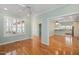 Living room with hardwood floors and views into kitchen at 2412 Mollynick Lane Ln, Wake Forest, NC 27587