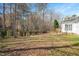 Backyard with a black metal fence at 2420 Mollynick Ln, Wake Forest, NC 27587
