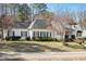 Lovely one-story home with green lawn, dark shutters, and mature trees in a quiet neighborhood at 2420 Mollynick Ln, Wake Forest, NC 27587