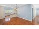 The kitchen and breakfast area features hardwood floors, white cabinets and countertops at 2420 Mollynick Ln, Wake Forest, NC 27587