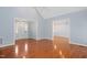 Spacious living room with hardwood floors, vaulted ceiling, and open floor plan at 2420 Mollynick Ln, Wake Forest, NC 27587