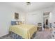 Cozy bedroom featuring plush carpet, charming decor, and a ceiling fan for added comfort at 2617 Cottage Cir, Raleigh, NC 27613