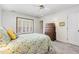 Bedroom showcasing a window with shutters, carpeted floors, and traditional wooden furniture at 2617 Cottage Cir, Raleigh, NC 27613