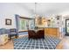 Inviting dining area with large window, chandelier lighting, and access to the kitchen at 2617 Cottage Cir, Raleigh, NC 27613