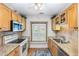 Cozy kitchen featuring updated cabinets, granite countertops, and a window seat at 2617 Cottage Cir, Raleigh, NC 27613