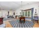 Bright living area boasts beautiful hardwood floors, vaulted ceilings, and comfortable seating at 2617 Cottage Cir, Raleigh, NC 27613