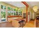 Bright kitchen featuring an island with seating, wooden countertops, and large windows with a view at 2713 Mcdowell Rd, Durham, NC 27705