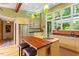 Bright kitchen with stainless steel appliances, a central island, and large windows with wooded views at 2713 Mcdowell Rd, Durham, NC 27705
