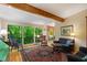 Cozy living room features large windows with a view, comfortable seating, and a decorative rug at 2713 Mcdowell Rd, Durham, NC 27705