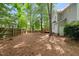 Expansive backyard with privacy fence and mature trees, backing to the home with a deck at 3008 Isabella Dr, Raleigh, NC 27603