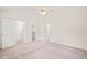 Spacious bedroom with neutral carpet, showing doorways to closet and hallway at 3008 Isabella Dr, Raleigh, NC 27603