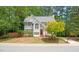 Charming two-story home featuring a red door and a well-manicured lawn at 3008 Isabella Dr, Raleigh, NC 27603