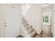 Bright foyer with staircase and tile flooring, leading to the living areas at 3008 Isabella Dr, Raleigh, NC 27603