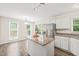 Bright kitchen with stainless steel appliances, granite countertops, and eat-in nook at 3008 Isabella Dr, Raleigh, NC 27603