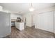 Well-lit kitchen featuring stainless appliances, central island, and vinyl floors at 3008 Isabella Dr, Raleigh, NC 27603