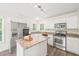 Bright kitchen with stainless steel appliances, granite countertops, and a center island at 3008 Isabella Dr, Raleigh, NC 27603