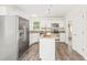 Bright kitchen with white cabinets, granite countertops, and stainless steel appliances at 3008 Isabella Dr, Raleigh, NC 27603