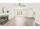 Spacious living room with large windows, fireplace, and modern flooring at 3008 Isabella Dr, Raleigh, NC 27603