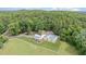 Aerial view of the home and pool surrounded by beautiful landscaping at 313 Shetland Rd, Rougemont, NC 27572
