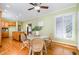 Bright breakfast nook with a wooden table, wicker chairs, and easy access to the kitchen at 313 Shetland Rd, Rougemont, NC 27572