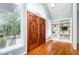 Elegant entryway featuring beautiful wooden double doors and a built-in bookcase at 313 Shetland Rd, Rougemont, NC 27572