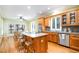 Spacious kitchen featuring granite countertops, a large island with seating, stainless steel appliances and hardwood floors at 313 Shetland Rd, Rougemont, NC 27572