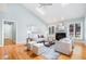 Bright living room featuring a vaulted ceiling, skylights, and a cozy fireplace at 313 Shetland Rd, Rougemont, NC 27572